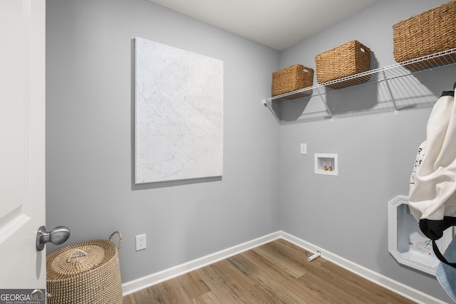128 Rolling Meadow Way, Kathleen, GA 31047 - laundry room featuring hookup for a washing machine, wood finished floors, and baseboards