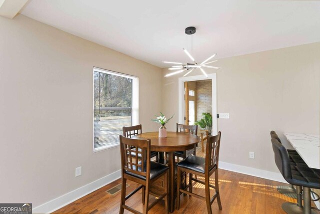 kitchen featuring beverage cooler, white cabinetry, sink, and appliances with stainless steel finishes