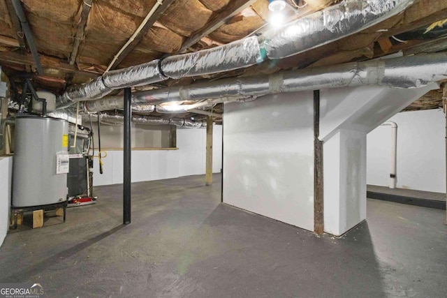 basement featuring gas water heater and heating unit