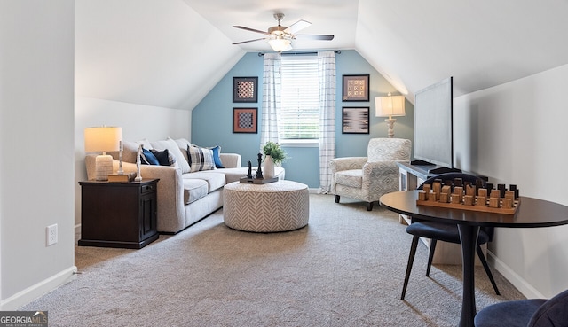 living area with lofted ceiling, carpet floors, a ceiling fan, and baseboards