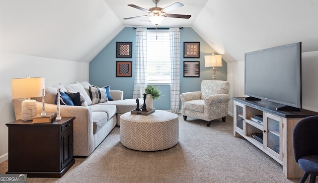 sitting room with carpet floors, lofted ceiling, and a ceiling fan