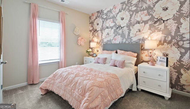 bedroom with carpet floors, visible vents, and baseboards