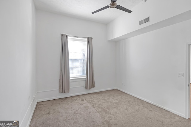 carpeted empty room with ceiling fan