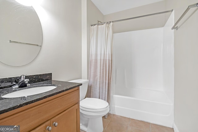 full bathroom featuring tile patterned floors, vanity, toilet, and shower / tub combo