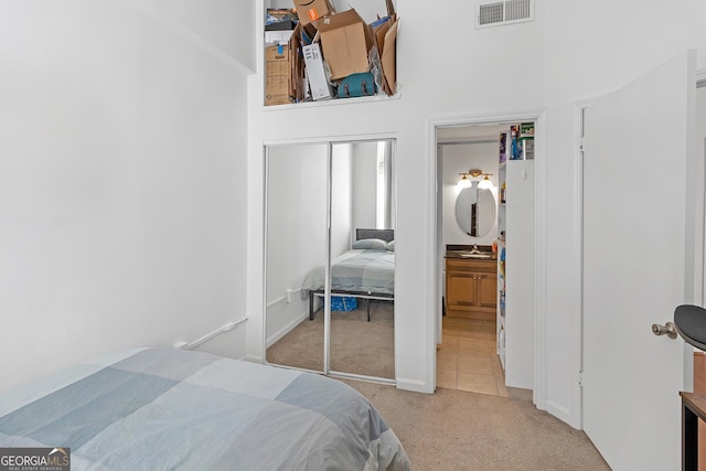 carpeted bedroom featuring a closet