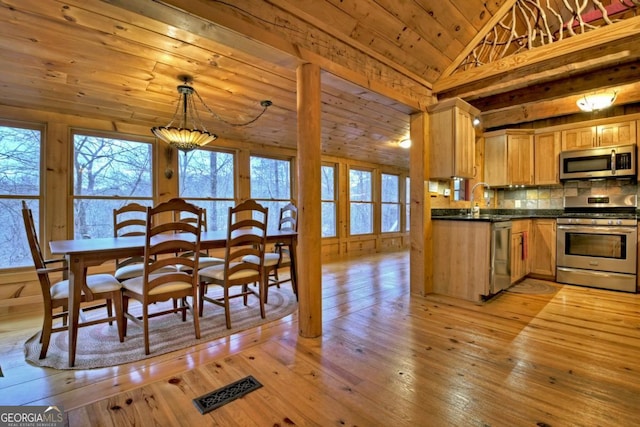 kitchen with wooden ceiling, stainless steel appliances, tasteful backsplash, light hardwood / wood-style floors, and vaulted ceiling