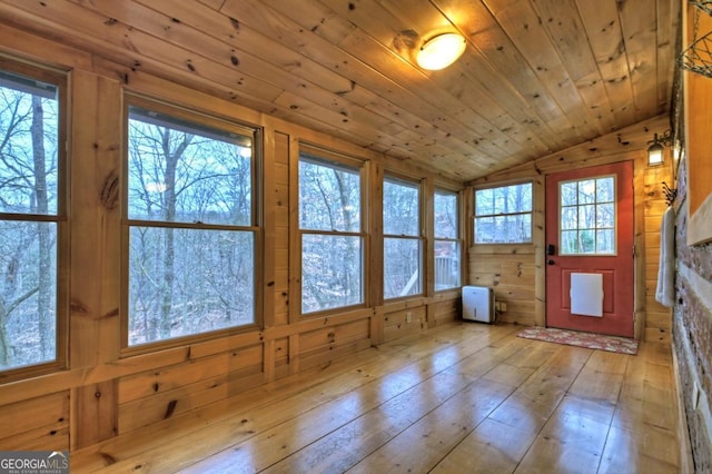 unfurnished sunroom with wooden ceiling and vaulted ceiling