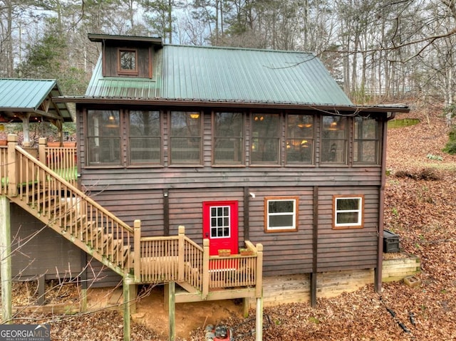 back of house with a sunroom