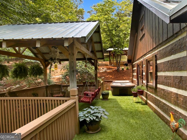 exterior space featuring a gazebo and a lawn