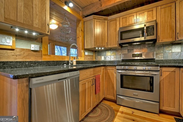 kitchen featuring decorative backsplash, stainless steel appliances, light hardwood / wood-style flooring, wooden ceiling, and dark stone countertops