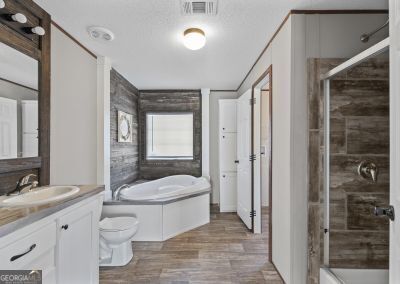 full bathroom featuring vanity, toilet, wood-type flooring, and independent shower and bath