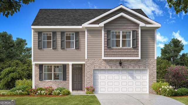 view of front of property with a front yard and a garage