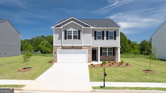 view of front of house with a front lawn and a garage