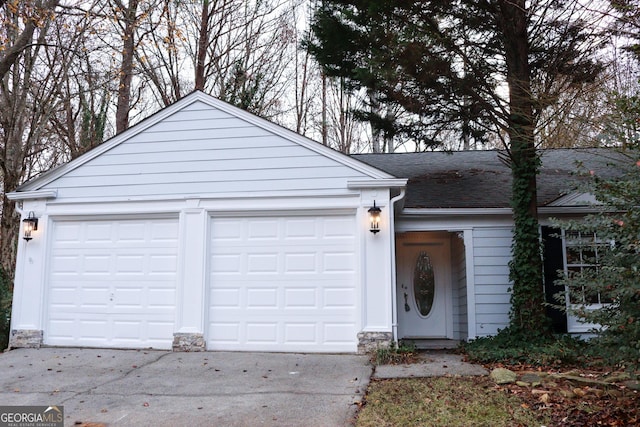 ranch-style house featuring a garage