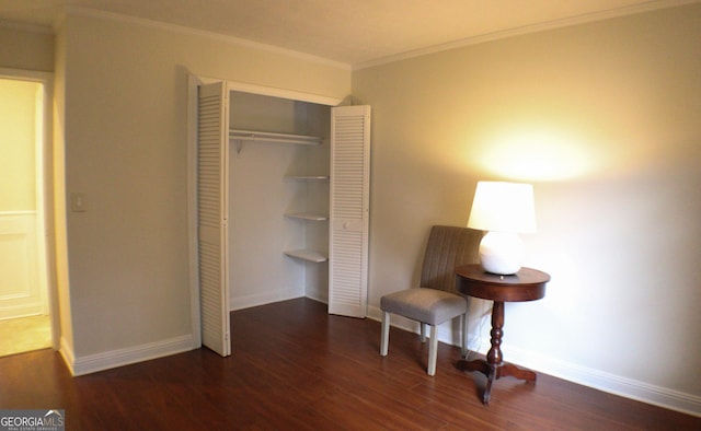 living area with crown molding and dark hardwood / wood-style floors