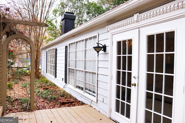 exterior space featuring french doors and a wooden deck