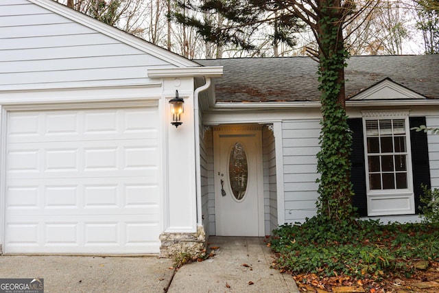 view of exterior entry featuring a garage