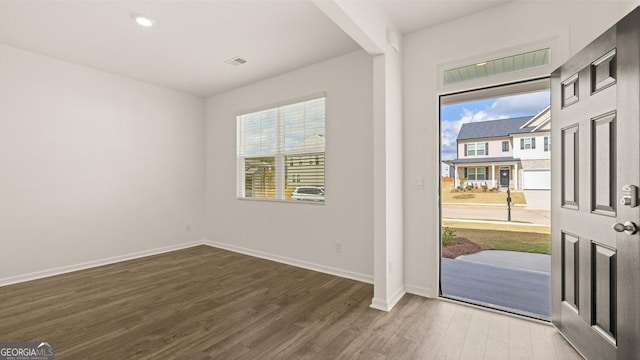 foyer entrance with hardwood / wood-style flooring