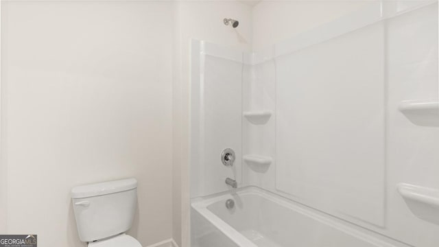 bathroom featuring bathing tub / shower combination and toilet