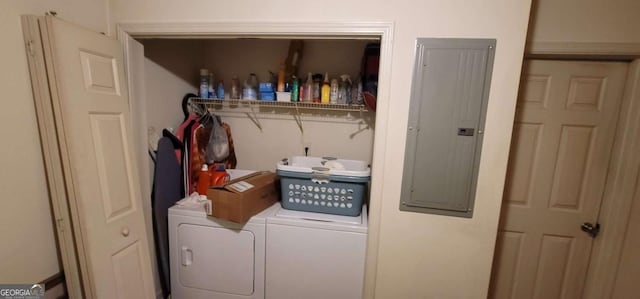 washroom featuring washing machine and dryer and electric panel