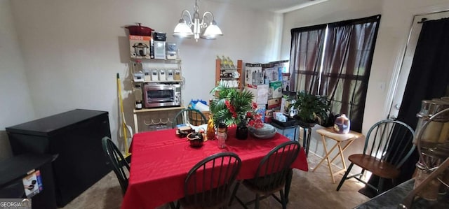 dining space featuring a notable chandelier