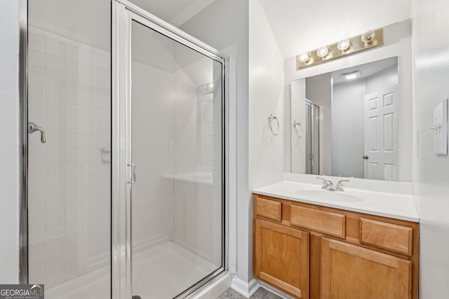 bathroom with vanity and a shower with shower door