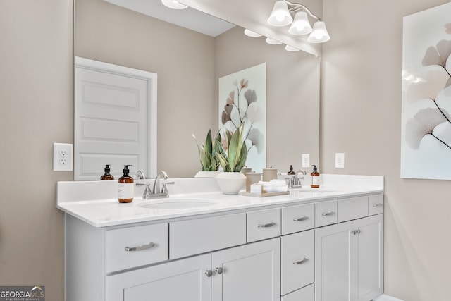 full bathroom featuring double vanity and a sink