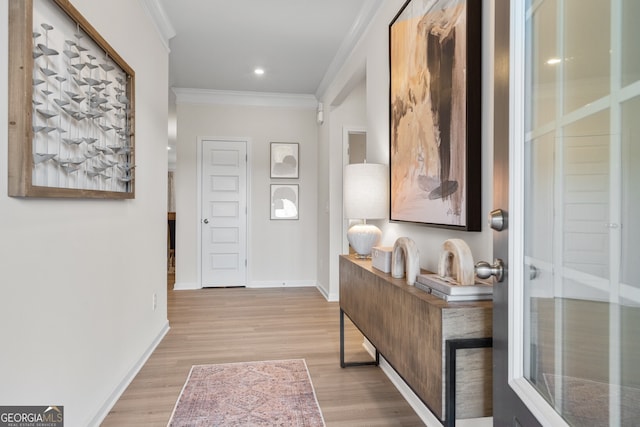 entrance foyer featuring recessed lighting, crown molding, light wood-style flooring, and baseboards