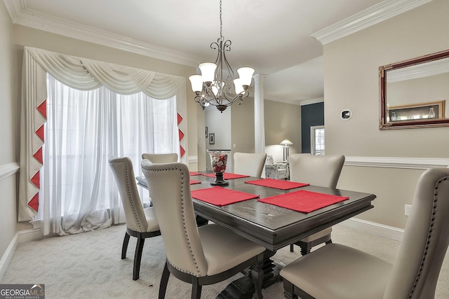 dining space featuring carpet flooring, crown molding, and a notable chandelier