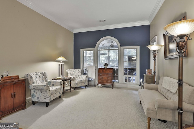 living area featuring carpet and crown molding