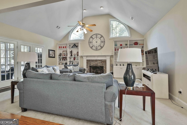 carpeted living room featuring ceiling fan, lofted ceiling, and a fireplace