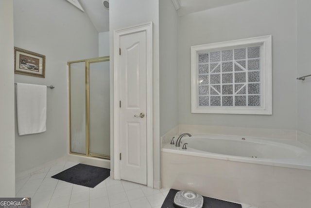 bathroom with tile patterned floors and separate shower and tub