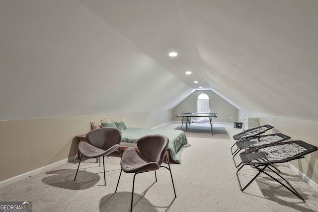 bedroom with light carpet and vaulted ceiling