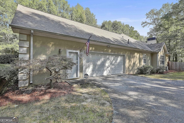 view of side of home featuring a garage