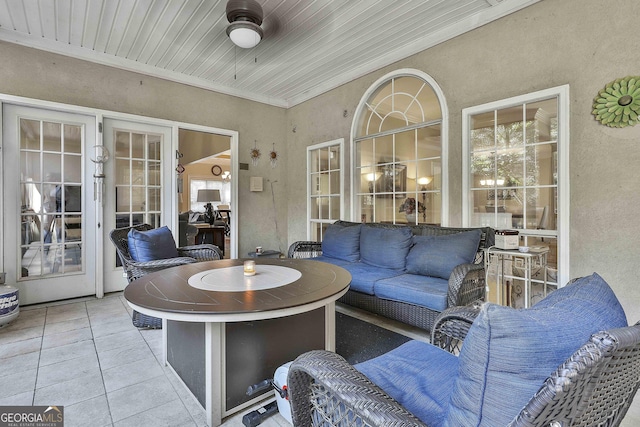 interior space featuring ceiling fan and wood ceiling