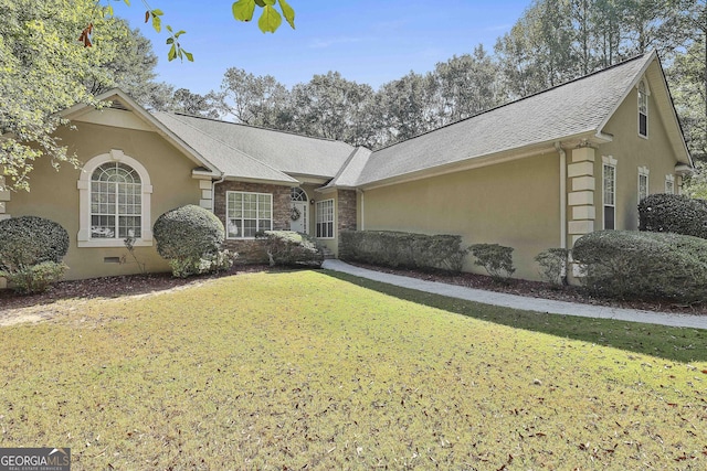 ranch-style home with a front yard