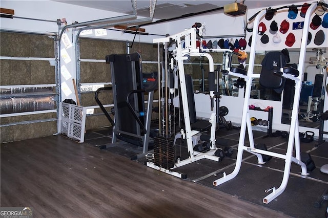 workout area featuring hardwood / wood-style floors