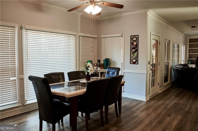 dining space featuring french doors, dark hardwood / wood-style flooring, ceiling fan, and crown molding