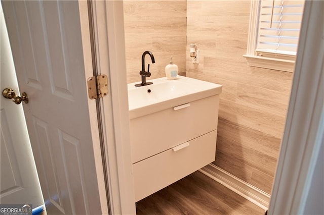 bathroom featuring vanity and hardwood / wood-style flooring