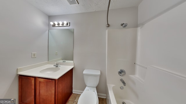 full bathroom featuring vanity, shower / bathtub combination, toilet, and a textured ceiling