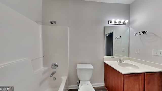 full bathroom with vanity, toilet, and washtub / shower combination