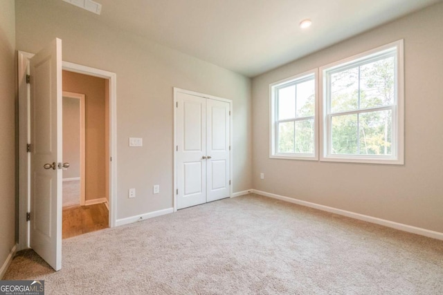 unfurnished bedroom with carpet