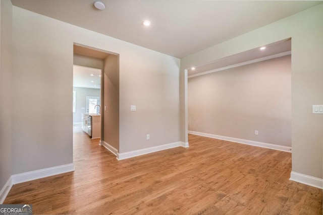 spare room with light hardwood / wood-style floors