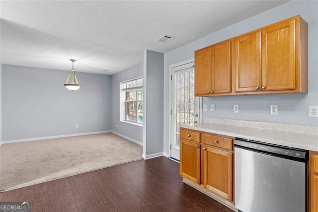 kitchen with dark carpet, pendant lighting, a textured ceiling, and stainless steel dishwasher