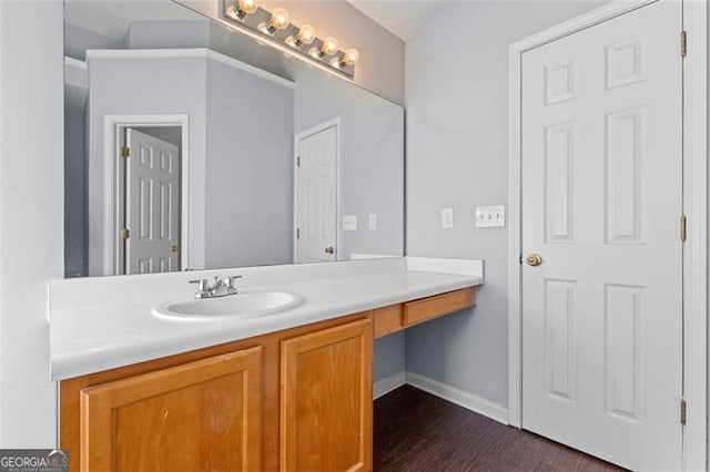 bathroom featuring vanity and wood-type flooring