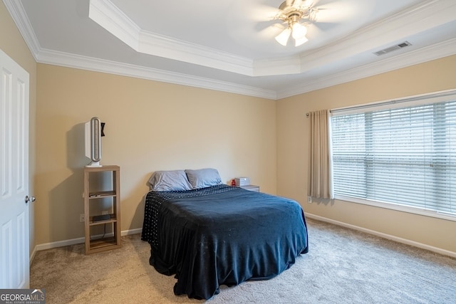 bedroom featuring a raised ceiling, ceiling fan, and light colored carpet