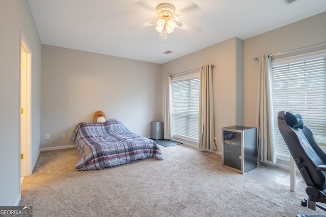 carpeted bedroom with ceiling fan