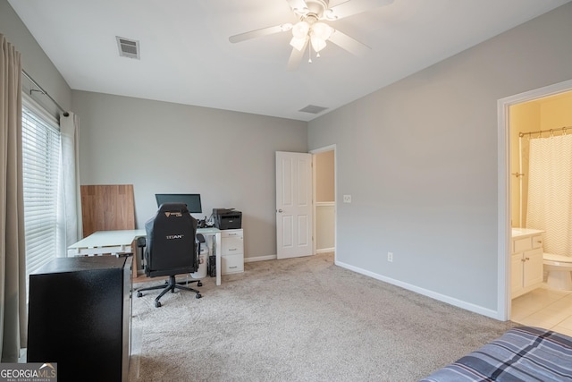 home office featuring light colored carpet and ceiling fan