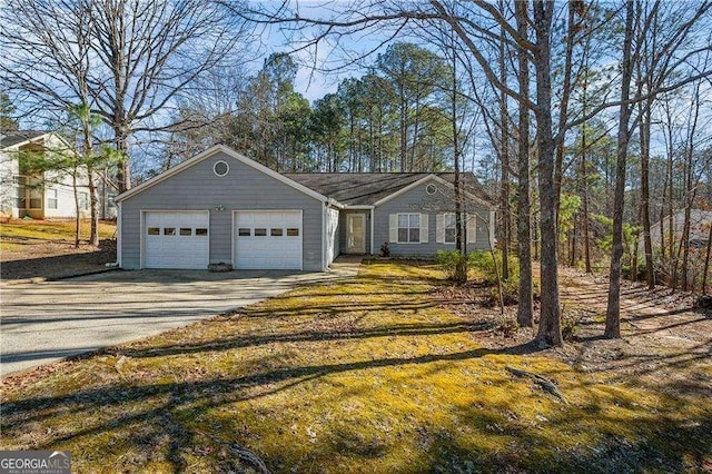 view of front facade with concrete driveway and a garage