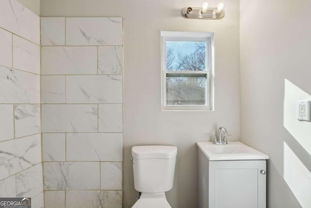 bathroom with vanity and toilet